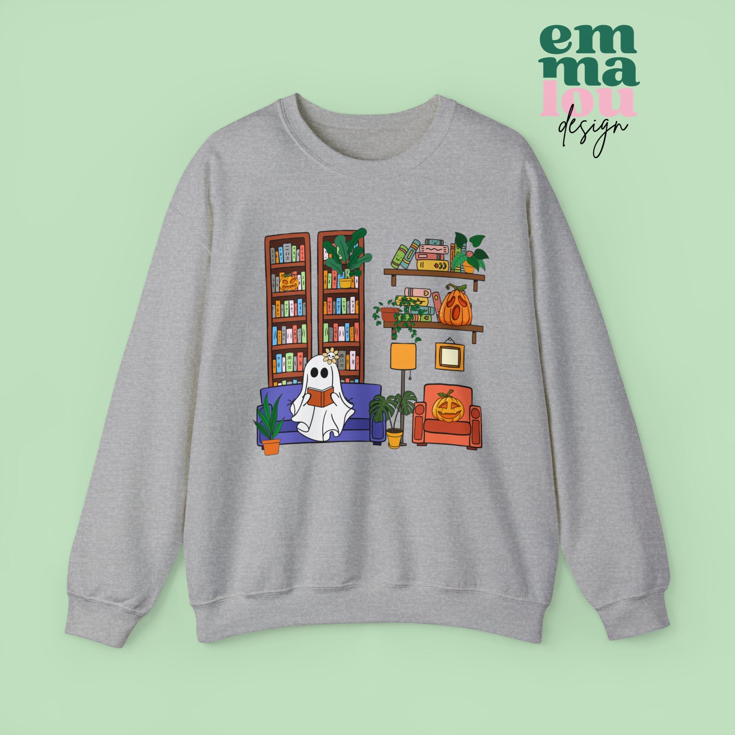 Athletic Grey Gildan Crewneck Sweatshirt Featuring a Graphic design featuring a cute ghost with a floral bow reading on a purple couch surrounded by cute house plants and 2 bookcases and shelves with books