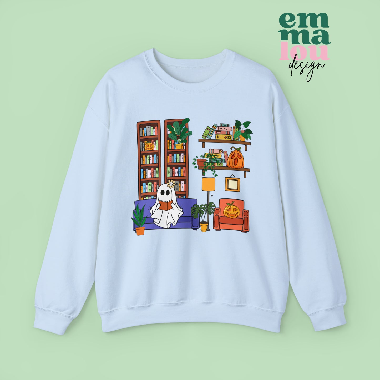 Light Blue Gildan Crewneck Sweatshirt Featuring a Graphic design featuring a cute ghost with a floral bow reading on a purple couch surrounded by cute house plants and 2 bookcases and shelves with books