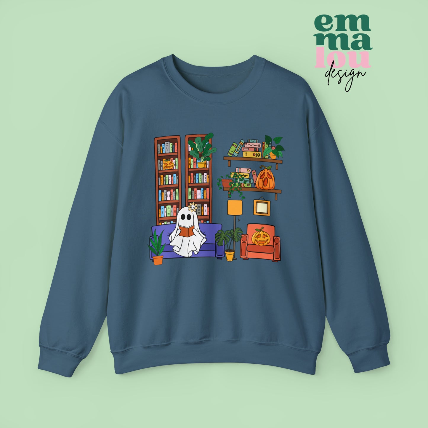 Indigo Gildan Crewneck Sweatshirt Featuring a Graphic design featuring a cute ghost with a floral bow reading on a purple couch surrounded by cute house plants and 2 bookcases and shelves with books
