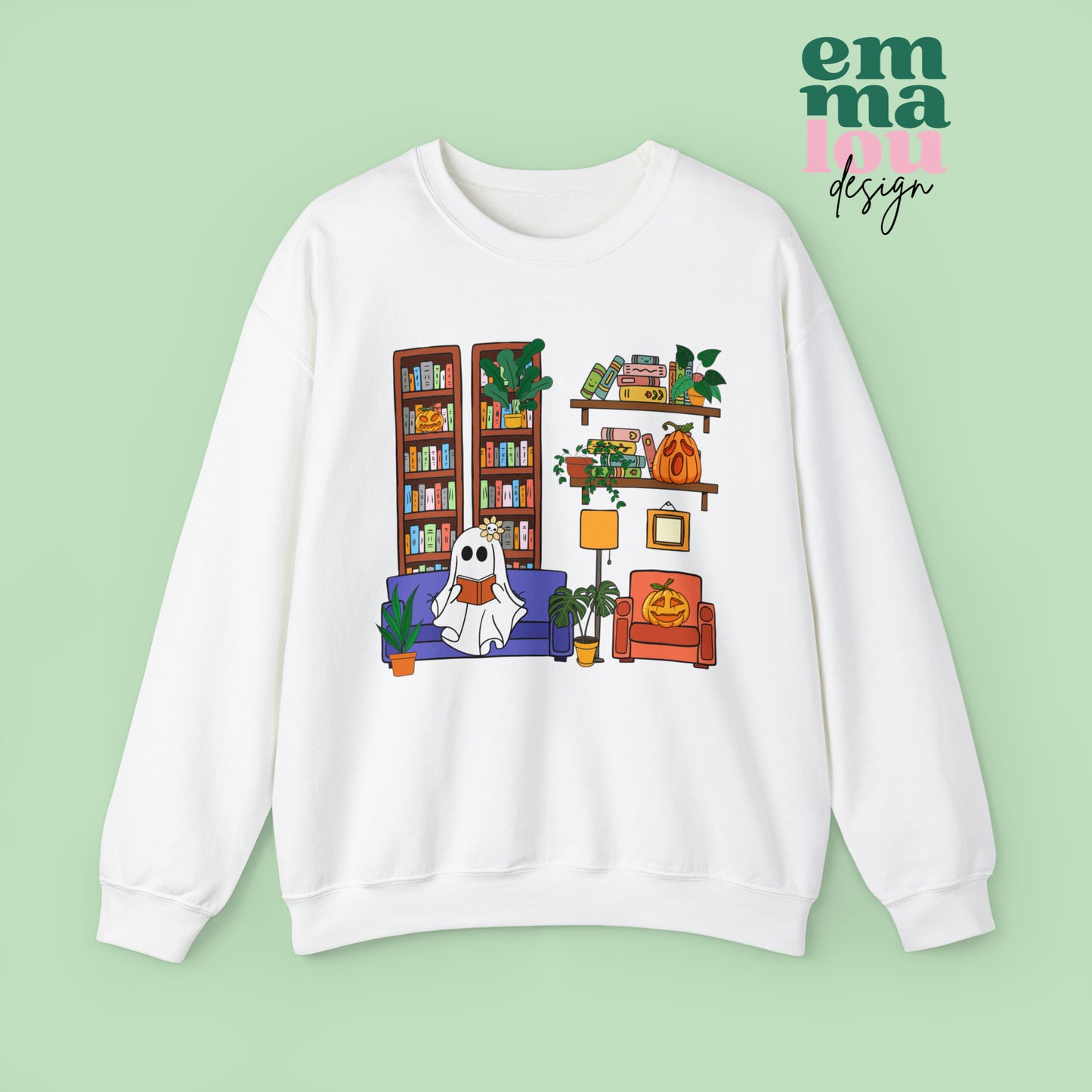 White Gildan Crewneck Sweatshirt Featuring a Graphic design featuring a cute ghost with a floral bow reading on a purple couch surrounded by cute house plants and 2 bookcases and shelves with books